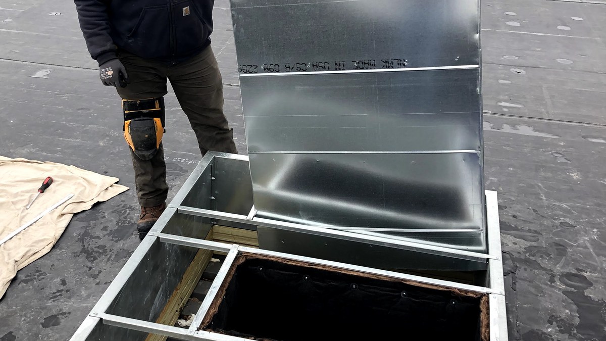 Rooftop commercial HVAC ductwork connection on a flat roof